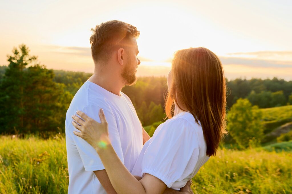 Outdoor portrait of adult happy loving hugging couple